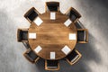 Overhead view of a modern conference table with eight chairs and blank notepads in a corporate setting Royalty Free Stock Photo