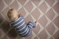 Overhead view of a 7 month old baby as they try to crawl for the first time Royalty Free Stock Photo