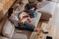 Overhead view of mother clicking channels