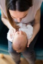 Overhead View Of Mother Cuddling Newborn Baby Son At Home Royalty Free Stock Photo