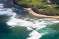 Overhead view of ocean waves crashing on a sandy tropical beach Royalty Free Stock Photo