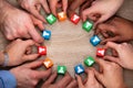 People`s Hand Holding Colorful Wooden Block With People Icon Royalty Free Stock Photo