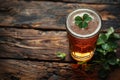 overhead view of a pint of beer with a lucky irish clover. St Patrick's day drink Royalty Free Stock Photo