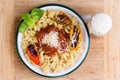 Overhead view of a plate of savory trottole pasta