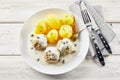 Overhead view of potatoes and meatballs with sauce Royalty Free Stock Photo