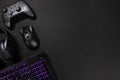 Purple lit keyboard by game controller and mouse Royalty Free Stock Photo