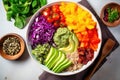 overhead view of a quinoa bowl with various brightly colored veggies
