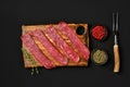 Overhead view of raw beef strips on black background Royalty Free Stock Photo