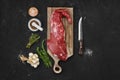 Overhead view of raw beef tri-tip loin on cutting board Royalty Free Stock Photo