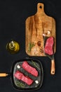 Overhead view of raw boneless beef strip steak ready for frying Royalty Free Stock Photo