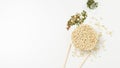 Overhead view of raw instant Asian egg noodles, seasonings and chopsticks on white background Royalty Free Stock Photo