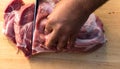 Overhead view of raw piece of pork on wooden background. Piece of fresh boneless pork, neck part or collar. Big piece of red raw m Royalty Free Stock Photo