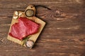 Overhead view of raw top side beef steak on wooden tabletop Royalty Free Stock Photo