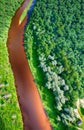 Overhead view of river crossing beautiful forest Royalty Free Stock Photo