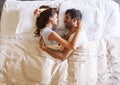 Overhead View Of Romantic Couple Lying In Bed Together Royalty Free Stock Photo