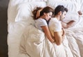 Overhead View Of Romantic Couple Lying In Bed Together Royalty Free Stock Photo