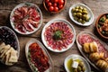 Authentic Spanish Tapas and Charcuterie Board on Rustic Wooden Table Royalty Free Stock Photo