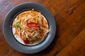 Overhead view on serving of authentic Som Tam, or Thai salad made up of multiple fruits and vegetables like papaya with