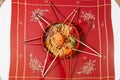 Overhead view on serving of yusheng or yee sang with raw salmon belly during Chinese New Year with chop sticks laid