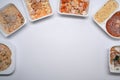 Overhead view of several frozen meal on white background with copy space.