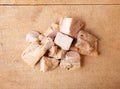 Top view of several pieces of roasted chicken breast on wood cutting board Royalty Free Stock Photo