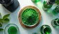 Overhead view shows spirulina powder, green solution in lab. Bowls, flasks with plant based liquid, microscope arranged for Royalty Free Stock Photo