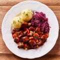 Overhead view of shredded cabbage and beef stew