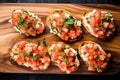 overhead view of shrimp bruschetta with finely chopped herbs