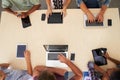 Overhead View Of Staff With Digital Devices In Meeting