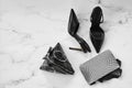 Overhead view of stilettos, fishnet tights and triangle hand bag Royalty Free Stock Photo