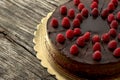 Overhead view of tasty raw chocolate cake decorated with raspber Royalty Free Stock Photo