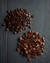 Overhead view of three varieties of coffee beans on an elegant dark vintage backdrop. Royalty Free Stock Photo