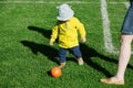 Overhead view of toddler playing soccer football with his mother Royalty Free Stock Photo