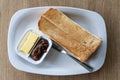 Overhead view of traditional Chinese sandwich toast bread served with butter and jam in kopitiam