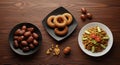 Traditional Iftar Meal with Dates, Doughnuts, and Savory Dish Royalty Free Stock Photo