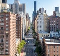 Overhead view of traffic driving down First Avenue through the crowded buildings of Manhattan in New York City