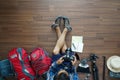 Overhead view of traveler man plan and backpack planning vacation travel Royalty Free Stock Photo