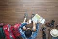 Overhead view of traveler man plan and backpack planning vacation travel