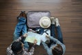 Overhead view of Traveler Young couple planning honeymoon vaca Royalty Free Stock Photo