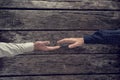 Overhead view of two businessman about to shake hands