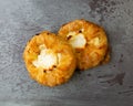 Top view of two delicious cream cheese danishes on a gray mottled tabletop