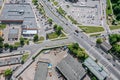 Overhead view of city crossroad near shopping mall and parking lot with cars Royalty Free Stock Photo