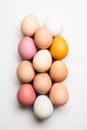 Overhead view of variety of multicolored eggs on white background. Easter Card