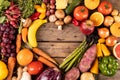 Overhead view of various vegetables and fruits with empty heart shape made on wooden table Royalty Free Stock Photo