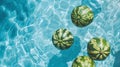 Overhead view of watermelons floating in a summer swimming pool