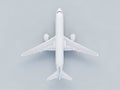 Overhead view of a white airplane model on a light gray background Royalty Free Stock Photo