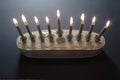 Overhead view of a white and gold Hanukkah menorah with candles lighted Royalty Free Stock Photo