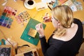 Overhead View Of Woman Making Jewelry At Home