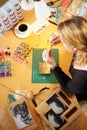 Overhead View Of Woman Making Jewelry At Home