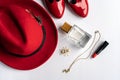 Fashionable women`s cosmetics and accessories flat lay in red color.